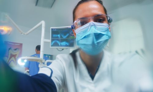 dentist-leaning-patient-putting-oxigen-mask-before-surgery-stomatological-office-doctor-working-modern-orthodontic-clinic-wearing-protection-mask-gloves-heatlhcare-checking.jpg