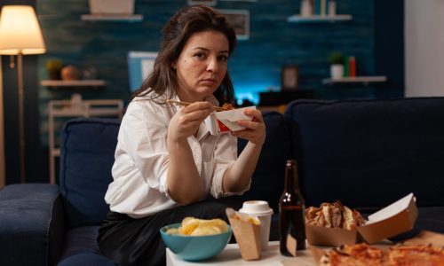 portrait-smiling-woman-eating-takeout-asian-noodles-with-chopsticks-living-room-sofa-office-worker-sitting-couch-evening-enjoying-chinese-takeaway-ramen-box-delicious-junk-food.jpg
